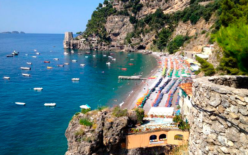 Main free section at Fornillo beach with pebbles and waterfront access