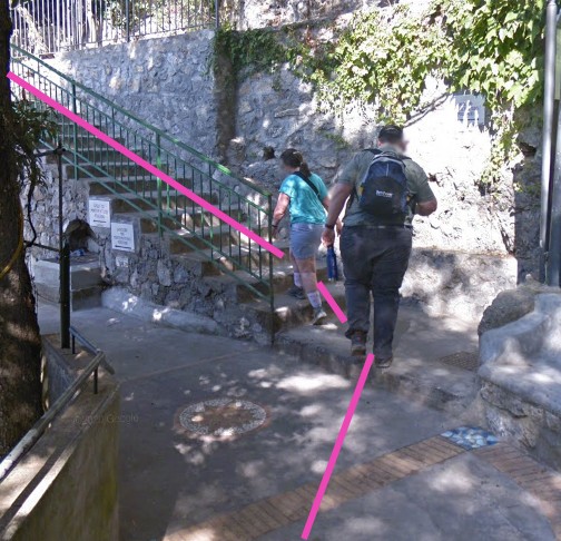 Stone steps ascending through Nocelle streets toward the bus stop