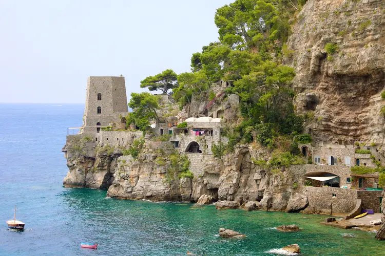 View of Fornillo Beach cove in Positano with the shoreline and cliffs