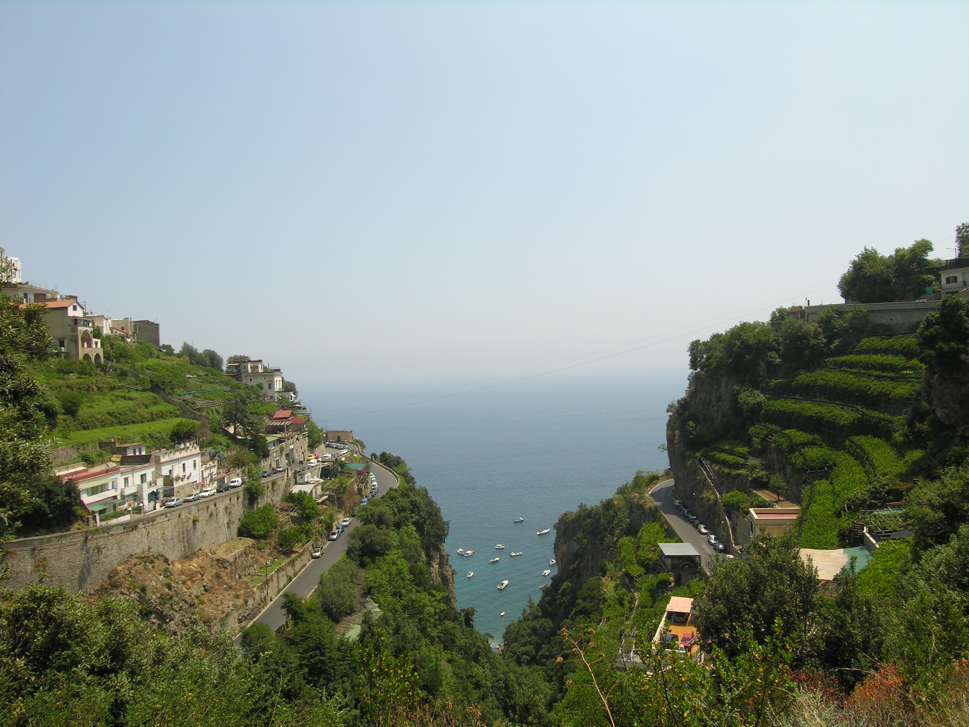 Coastal road on the Amalfi Coast with steep cliffs and tight bends