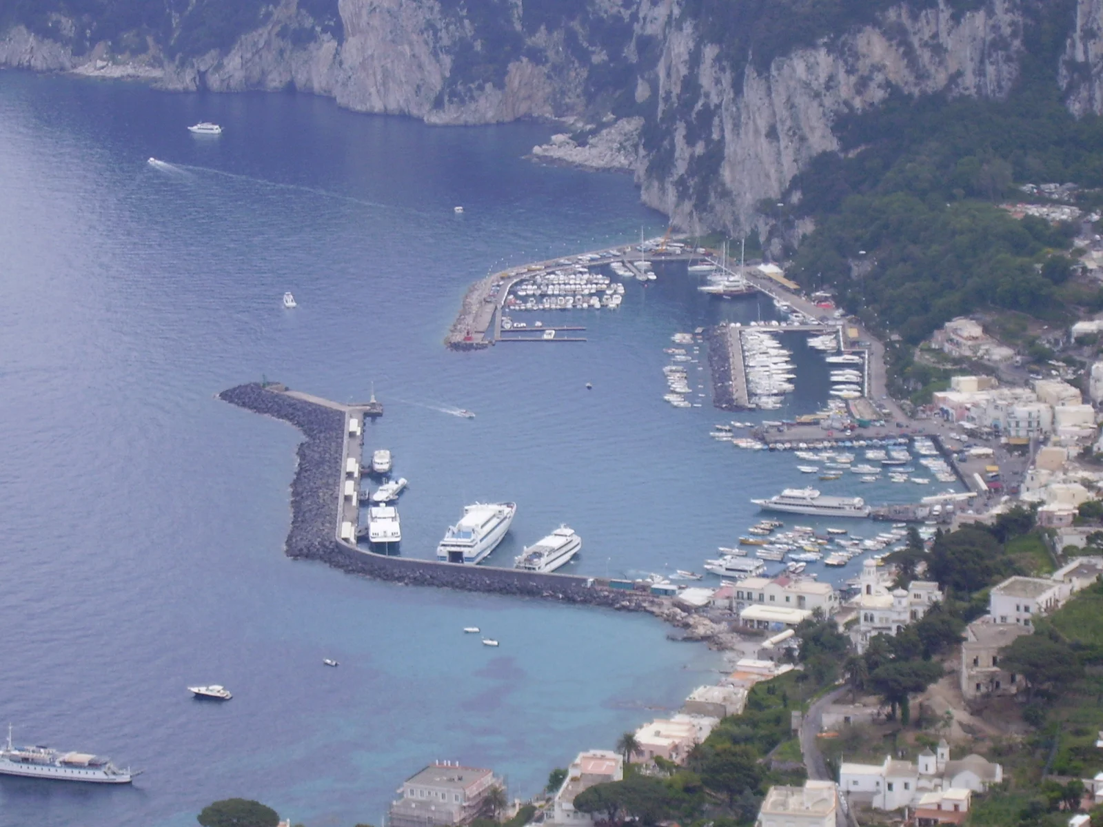 Marina Grande port in Capri with ferries and ticket booths along the waterfront
