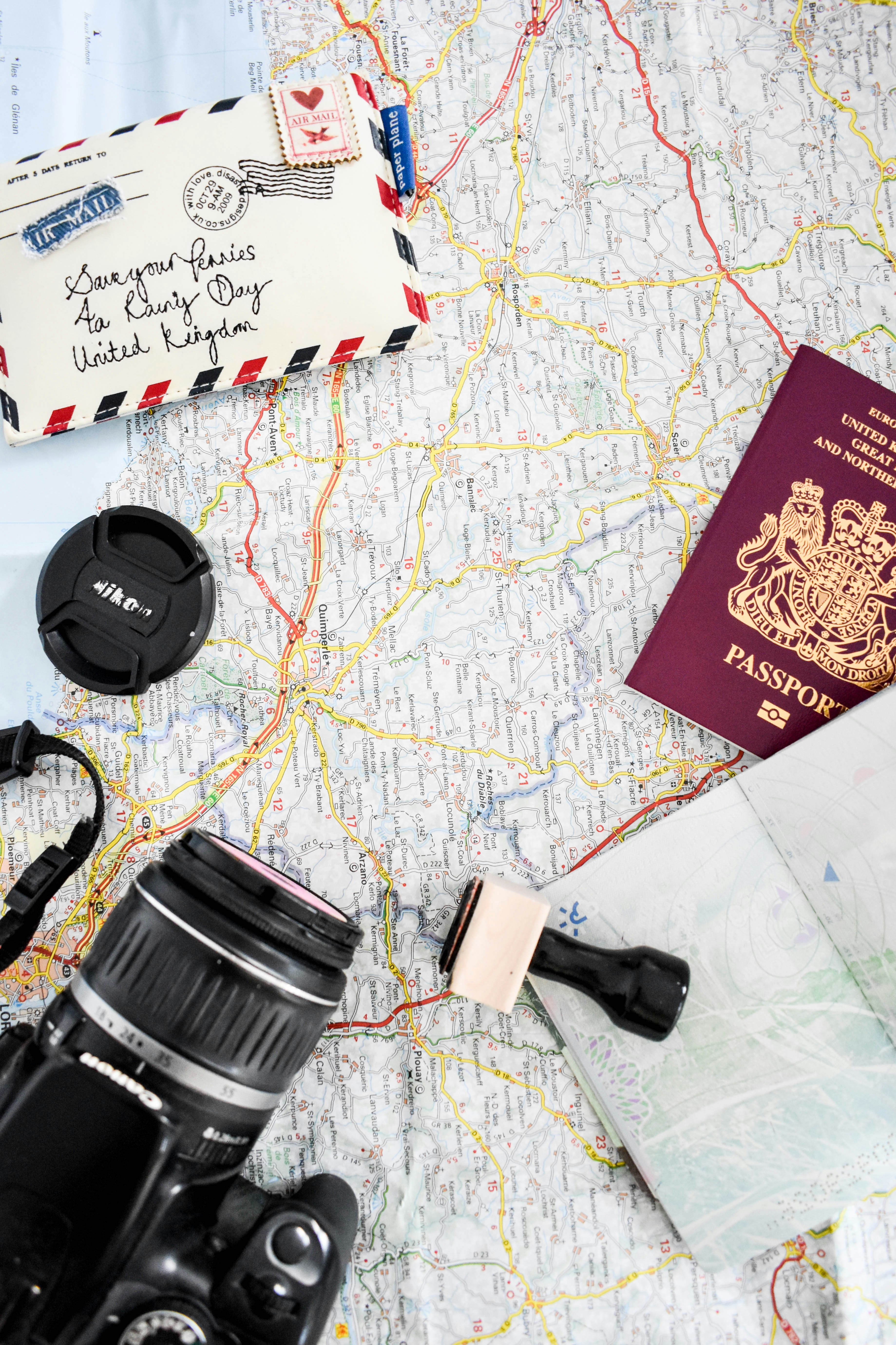 Budget travel planning with coins and ferry tickets.